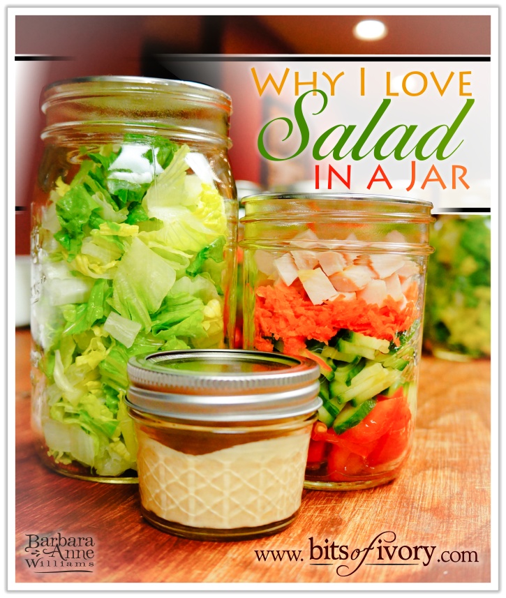 Chopped lettuce, vegetables, and dressing in jars, "Why I Love Salad in a jar" | www.bitsofivory.com