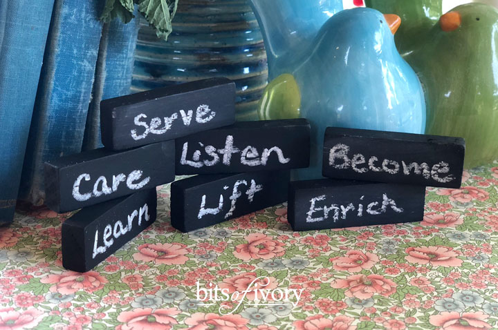 Mini chalkboards from old game pieces with words written on them