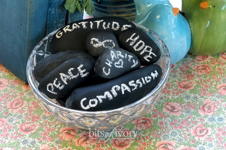 A bowl of chalkboard stones with encouraging words written on them
