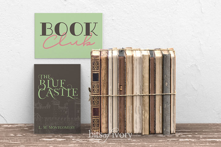 Book Club sign with stack of books and cover showing the title The Blue Castle by L. M. Montgomery