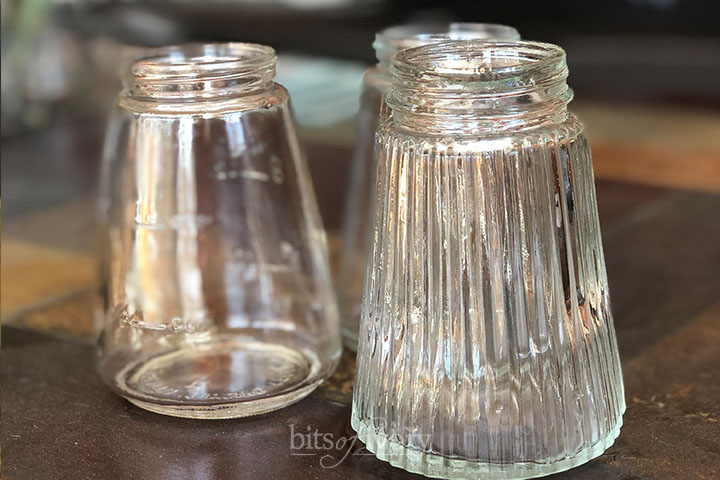 Three glass syrup jars
